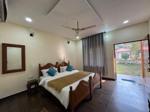 Ένα ή περισσότερα κρεβάτια σε δωμάτιο στο The jungle retreat ranthambore