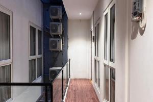 a corridor of a building with two radios on the wall at Senayan Suites in Jakarta