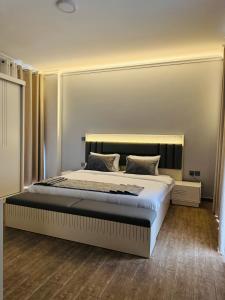 Giường trong phòng chung tại LACASA Kiyovu - Serviced Apartments