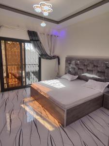 Ένα ή περισσότερα κρεβάτια σε δωμάτιο στο Résidence marie