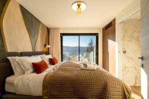 En eller flere senge i et værelse på Villa Rita - vue Lac