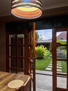 a dining room with a view of a yard at Marini Ndoto in Themi