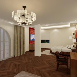 a living room with a bed and a chandelier at Rambagh Resort by Stotrak, Gwalior in Gwalior