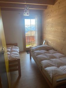 Ένα ή περισσότερα κρεβάτια σε δωμάτιο στο Chalet Allegra AL0