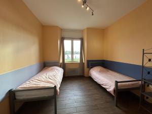 Una cama o camas en una habitación de Gîte 2 couchages Idéal pro BTP Tancarville