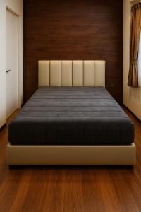 Postel nebo postele na pokoji v ubytování ANNKAMii INN