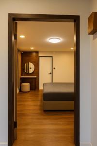 Postel nebo postele na pokoji v ubytování ANNKAMii INN