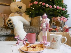 a table with a plate of food and a teddy bear at Best Western Hotel Lakmi Nice in Nice