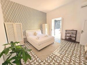 Ένα ή περισσότερα κρεβάτια σε δωμάτιο στο La terrazza