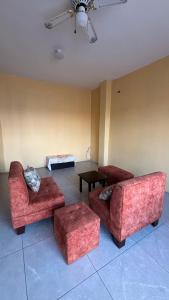 a living room with two couches and a table at Casa con Piscina Privada in Salinas