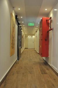 an empty hallway in a hospital with a hard wood floor at Salma Hotel in Cairo