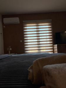 Ένα ή περισσότερα κρεβάτια σε δωμάτιο στο Apartman Ika 4N