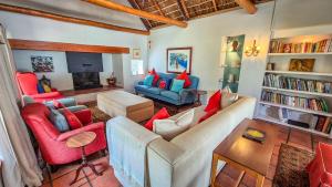 a living room with a couch and chairs and a fireplace at Coppull Private Nature Reserve in Stanford
