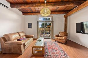 a living room with a couch and a table at Willow Street Cottages in Bluff