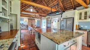 a kitchen with white cabinets and a counter top at Coppull Private Nature Reserve in Stanford