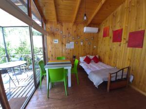 Ένα ή περισσότερα κρεβάτια σε δωμάτιο στο Carolin Cacao Cabins - Quillay