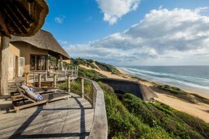 a beach house with a view of the ocean at Monarch Beach Villa in Cimbene