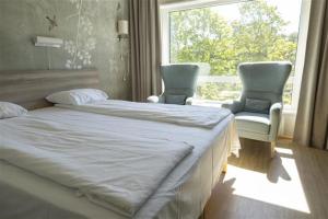 Postel nebo postele na pokoji v ubytování Ullevål Hotel + 18 fotografií