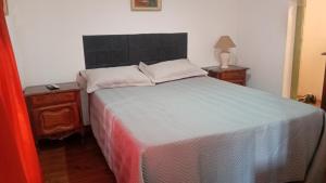 Ένα ή περισσότερα κρεβάτια σε δωμάτιο στο CASITA dE PLAYA LOS LOBOS