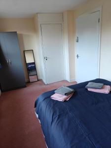 En eller flere senge i et værelse på Wilmslow House