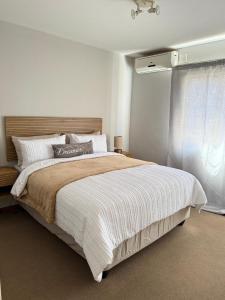 Ένα ή περισσότερα κρεβάτια σε δωμάτιο στο Kloppenheim Sectional Lifestyle Complex