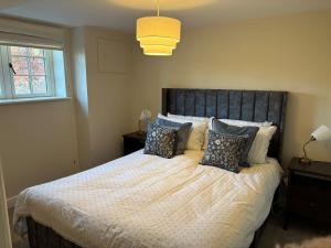 En eller flere senge i et værelse på Patience Cottage, an old bothy cottage