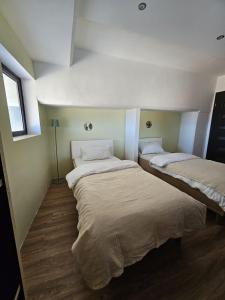 Postel nebo postele na pokoji v ubytování Soulnest Light