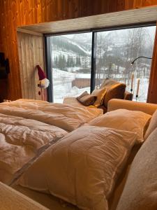 Ένα ή περισσότερα κρεβάτια σε δωμάτιο στο Charming and modern ski-in ski-out cottage