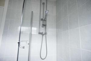 a shower in a bathroom with a shower at Skiddaw Heights in Keswick +28 photos