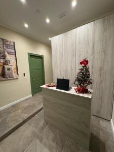 a office with a christmas tree on a counter at Andrea House in Naples