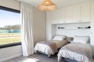 Ένα ή περισσότερα κρεβάτια σε δωμάτιο στο Hermosa casa a estrenar en barrio privado El Quijote +45 φωτογραφίες