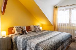 Voodi või voodid majutusasutuse Penzion U Šelongů toas