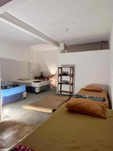 Ένα ή περισσότερα κρεβάτια σε δωμάτιο στο Mandalas Hideout