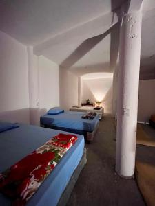 Ένα ή περισσότερα κρεβάτια σε δωμάτιο στο Mandalas Hideout