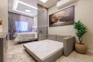 a living room with a couch and a bedroom at Apartamento 401 wiithhoeftf in Pomerode