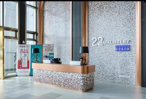 a lobby with a reception desk in a building at 22Macalisterz Georgetown Studio in George Town +27 photos