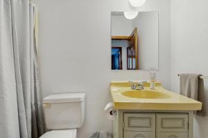 a bathroom with a sink and a toilet and a mirror at The Prospect House in Bethlehem +23 photos