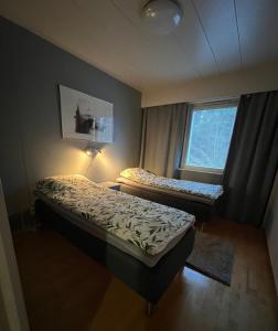 En eller flere senge i et værelse på Cityflat by Travel Center