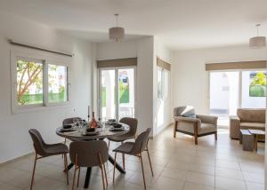 a dining room with a table and chairs at Crystal Villa walk by Merit Casinos By HolidayKeys in Kyrenia