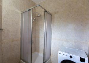 a shower in a bathroom with a washing machine at Crystal Villa walk by Merit Casinos By HolidayKeys in Kyrenia +15 photos