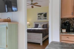 a bedroom with a bed and a ceiling fan at The Jr. Suite at 205 Royal Poste Rd. in Sunset Beach