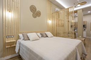 En eller flere senge i et værelse på Apartamentos Brisas de Cádiz 1