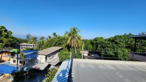 arial view of a house with trees in the background at Sarin Guesthouse สาริน in Koh Tao