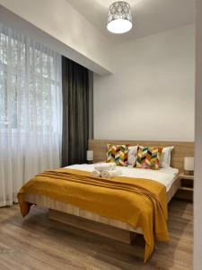 En eller flere senge i et værelse på 27 RENT Apartments