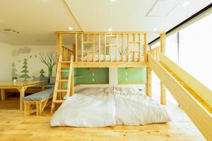 Postel nebo postele na pokoji v ubytování Goen Little hatchi 子供が喜ぶ隠れ家宿