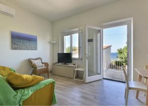 Et tv og/eller underholdning på Trilocale Giglio - vista sul mare e sui tramonti