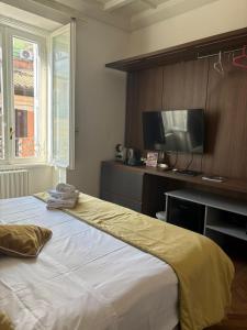 Ένα ή περισσότερα κρεβάτια σε δωμάτιο στο Ah Suite Trevi +7 φωτογραφίες