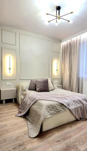 Ένα ή περισσότερα κρεβάτια σε δωμάτιο στο Apartamenty Kościuszki Winda Klimatyzacja