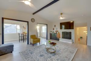 a living room with a couch and a table at The Maharaja Retreat with Hot Tub and EV Charger! in Yucca Valley
