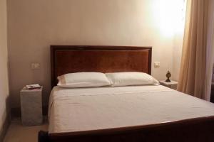 Ένα ή περισσότερα κρεβάτια σε δωμάτιο στο Casa Cesira, antica dimora con cucina professionale - Marea Stays Collection